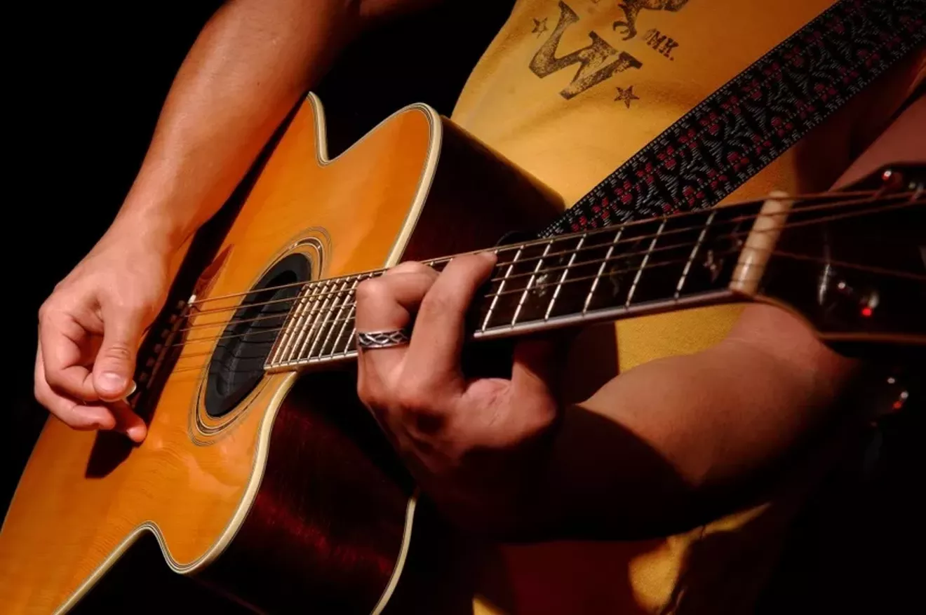 acoustic-guitar-player.webp