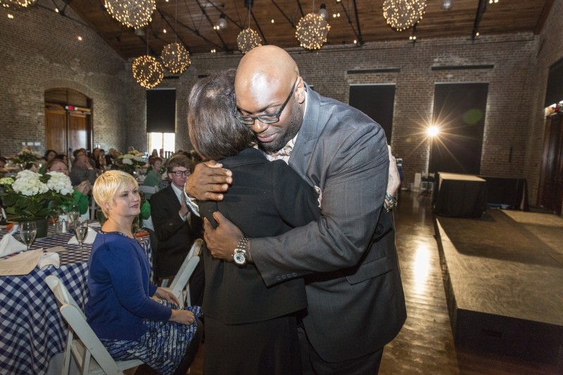 The Rev. C. MeGill Brown of Second African Baptist Church hugs Rosalie Morris. Mrs. Morris and her husband Charles are playing a key role in bringing the Canyon Ranch Institute’s wellness program to an under-served population in Savannah.