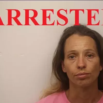 Image: Mom who allegedly tied child to crab trap found hiding in store men's room