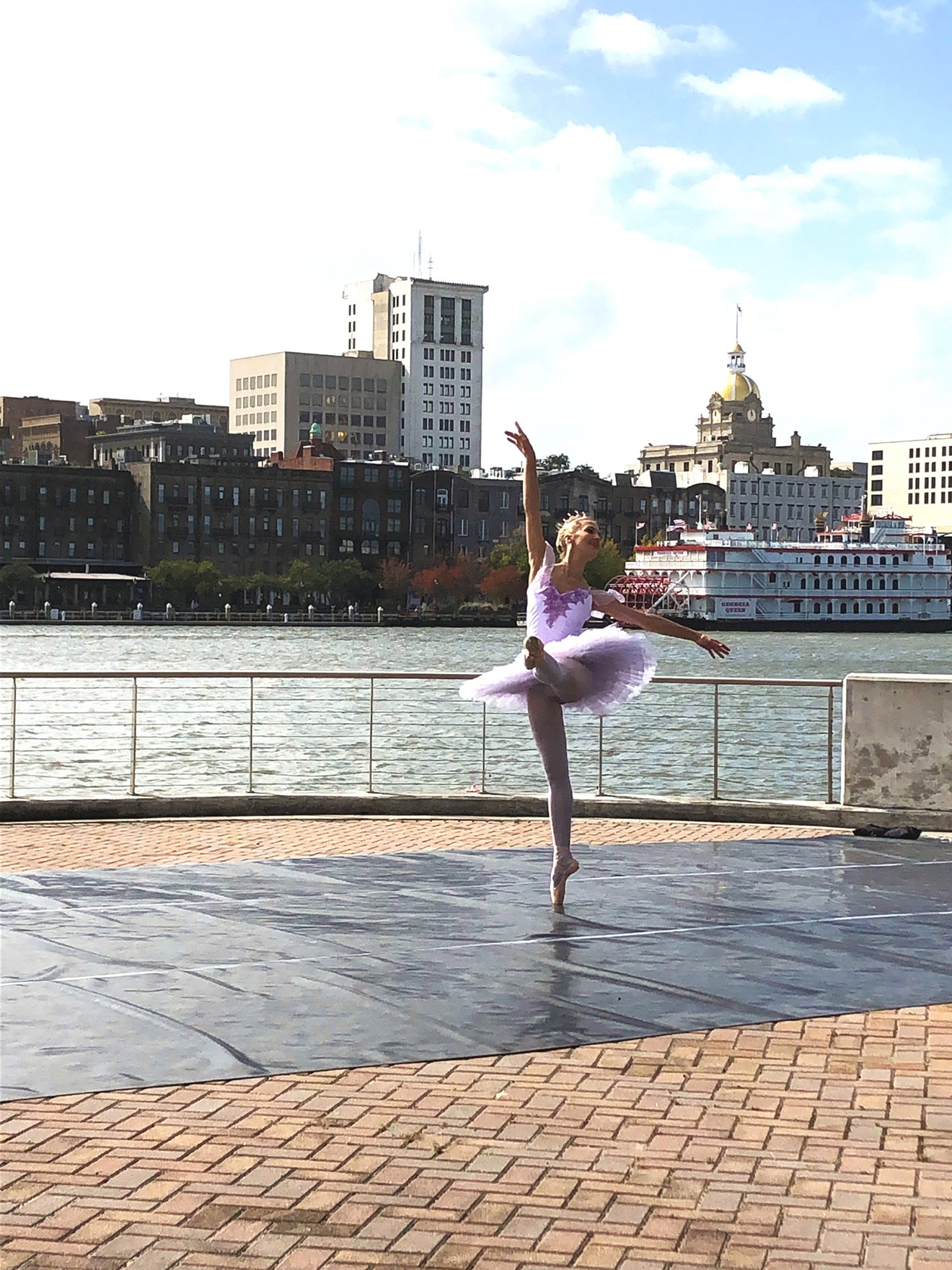 A member of Savannah Ballet dances on River St.