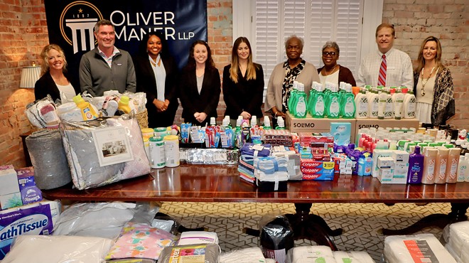 Giving back: Oliver Maner presents donations from Women’s Emergency Housing Center supply drive