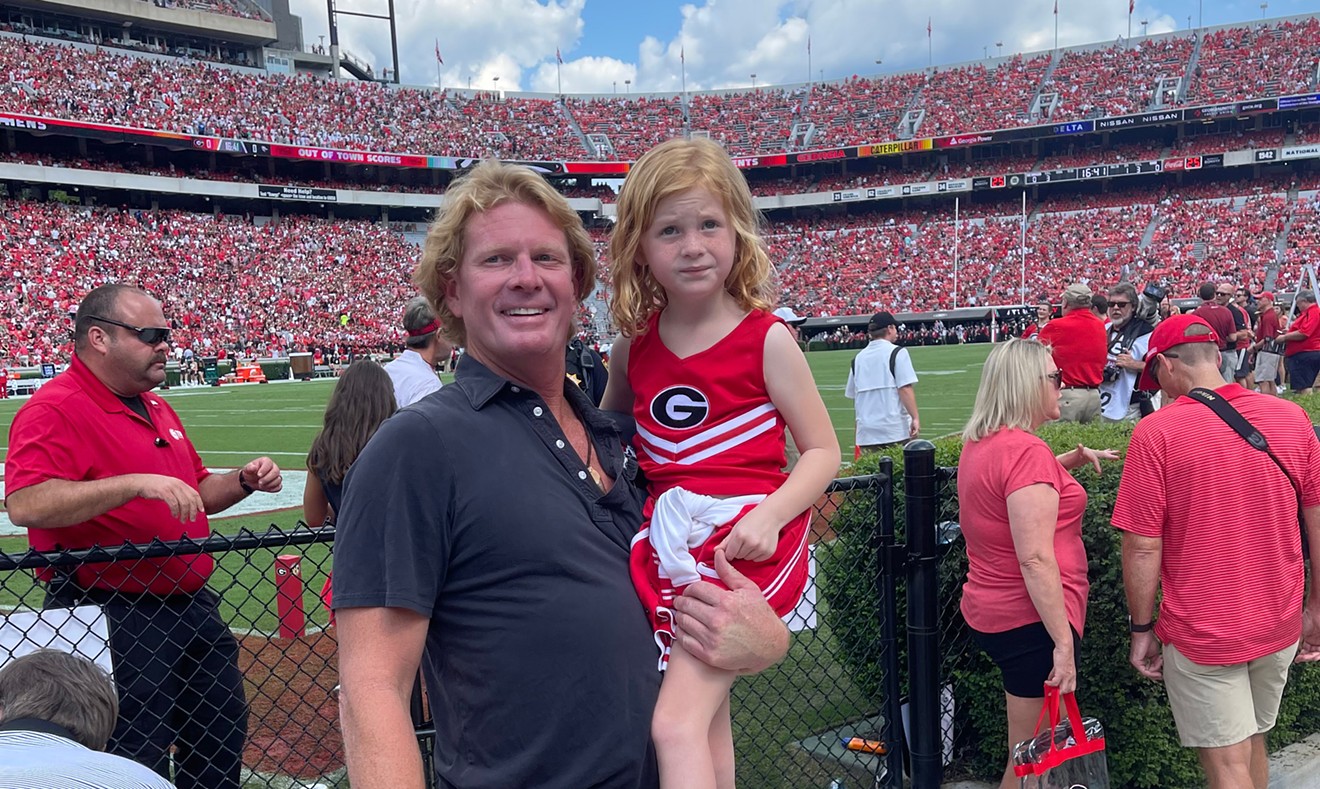Corde Wilson and his daughter at a UGA home game in Athens.