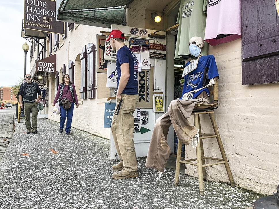 Savannah visitors on River Street ignore Mayor Johnson’s emergency order to wear face masks in public spaces.
