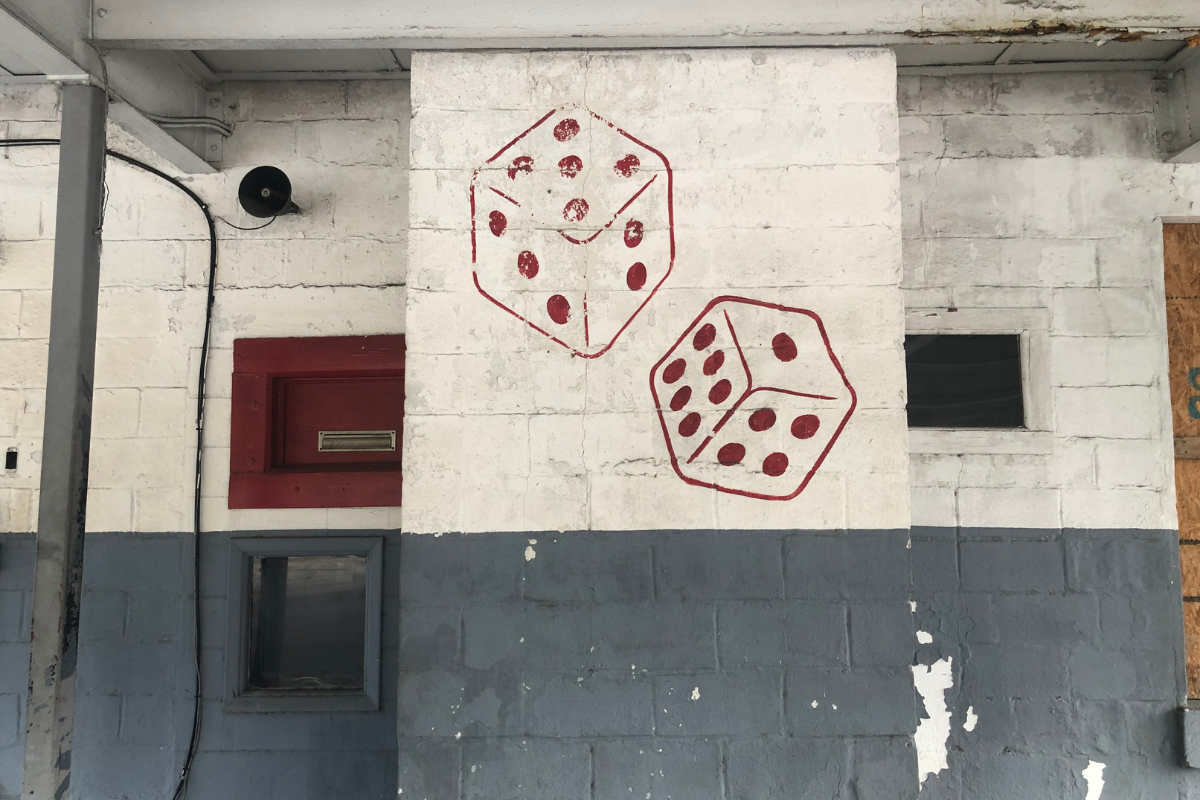 A mural of dice is on the wall of the former Daiss Service Center.