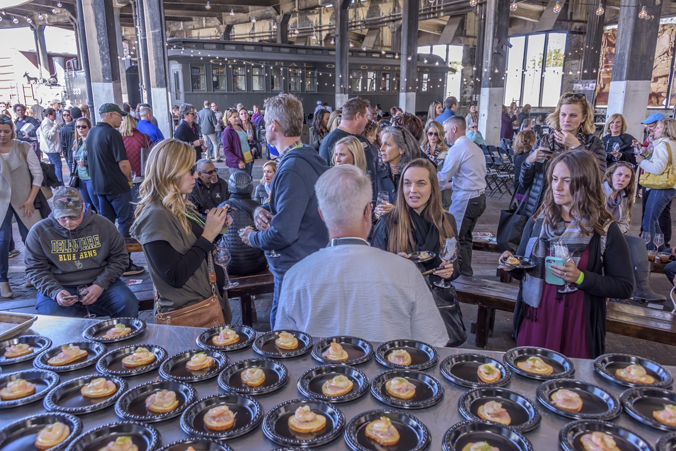 Festival goers at a previous year’s Food and Wine festival enjoy the diverse pairings and crowd setting.