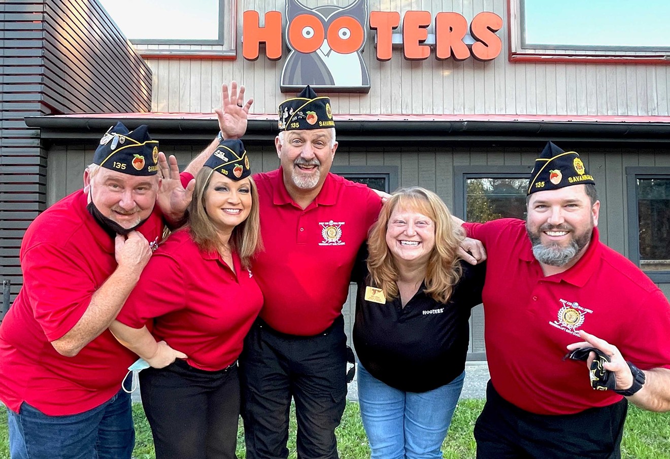 Members of the American Legion Post 135 celebrate Hooters’ sponsorship of this year’s event.