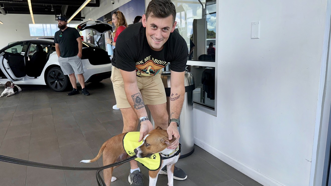 Tesla Hosts Renegade Paws Dog Adoption Event