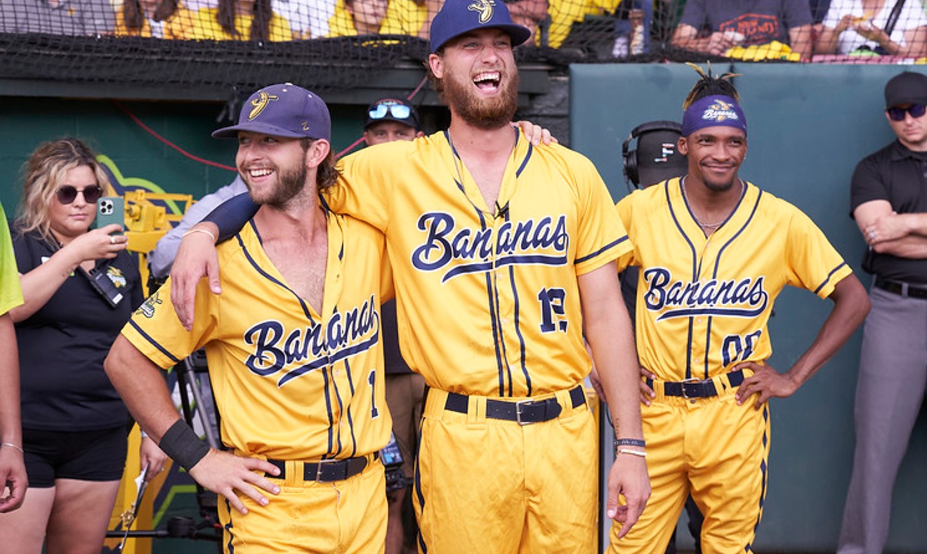 Savannah Bananas players Bill Leroy, Kyle Luigs and Maceo Harrison head out to the field at Grayson Stadium. The Bananas have sold out the 2022 season and are looking to defend their Coastal Plain League title.